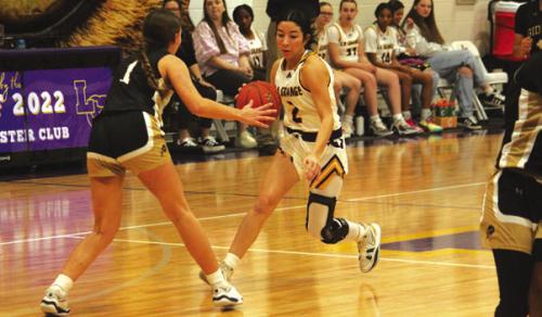 La Grange’s Landri Hernandez drives the ball down the court Friday. Photo by Jeff Wick