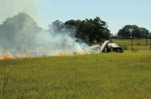 Pictured above, a Schulenburg fire truck battles a grass fire near Swiss Alp on Wednesday, Oct. 5. Photo by Andy Behlen