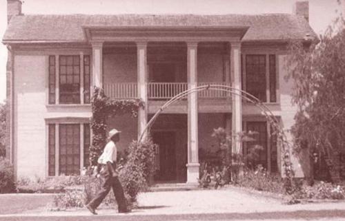 Moose’s fraternal grandparents, William and Hedwig Mennike, lived in a large two-story house on South Main in La Grange that was sold and torn down in the 1950s. Richard and Molly Cernosek used the lumber to frame their first house on Ella Lane. The pedestrian is not identified. Street view of Mennike home shot in 1950 is courtesy of the Fayette Heritage Museum and Archives.