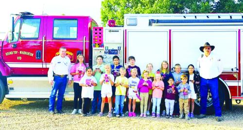 Fire prevention week poster contest winners from Round Top-Carmine Elementary were: Carlos Osmar Lopez, Rowdy Richards, Adalynn Lyons, Emery Vincent, Hunter Kaspar, Steeley Schatte, Emma Rodriguez, Collyns Schatte, Hunter Wagner, Brooke McKenzie, Carter Matejcek, Sawyer Koska, Antonio Aguilar, Bowen Williams, Daisy Visser and Grant Kieke. Trophies were presented by Round Top-Warrenton V.F.D. President/Asst. Chief Calvin Krause and Capt. Keith Burcalow.