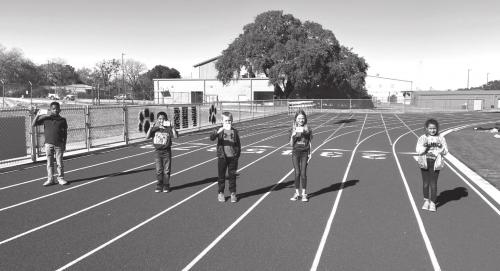An example of some of the Flatonia students participating in the Marathon Kids program, left to right: LeAnthony Anderson (3rd grader), Isaiah Tovar (3rd grader), Gage Grahmann (2nd grader), Stassney Ahrens (3rd grader) and Briana Pavlica (3rd grader)