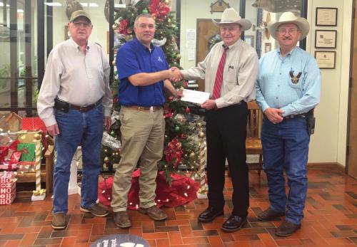 Pictured from left is Fayette County Crime Stoppers 2nd Vice President Joe Cernosek, Carmine State Bank President Chris Coufal, Fayette County Crime Stoppers President Dan Mueller, Secretary Randy Noviskie.