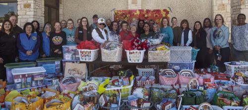 Local volunteers gathered at Tejas Healthcare in La Grange last Thursday for the annual Thanksgiving basket collection drive which provides food baskets for clients of the Family Crisis Center. The volunteers had collected 67 baskets when the Record visited Thursday morning, and more were still arriving. Photo by Andy Behlen