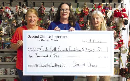Tracy Denton, director of marketing, communications, and training at Fayette Electric Cooperative (center), gratefully receives a grant from Marlene Schnell, assistant store director at Second Chance Emporium (left), and Gayle Schielack, store director at Second Chance Emporium (right). These funds will help Fayette Electric Cooperative’s Charitable Donor-Advised Fund continue providing free books to children in Fayette County through Dolly Parton’s Imagination Library.