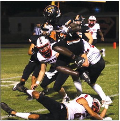 Janecek Runs for 4 TDs to Lead Shorthorns to Streak-Snapping Win
