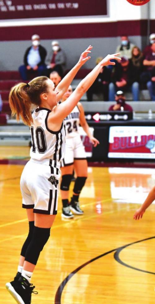 Flatonia’s Shannen Novak stays hot on 3 point shots Friday night in Flatonia against Louise. Photo by Stephanie Steinhauser