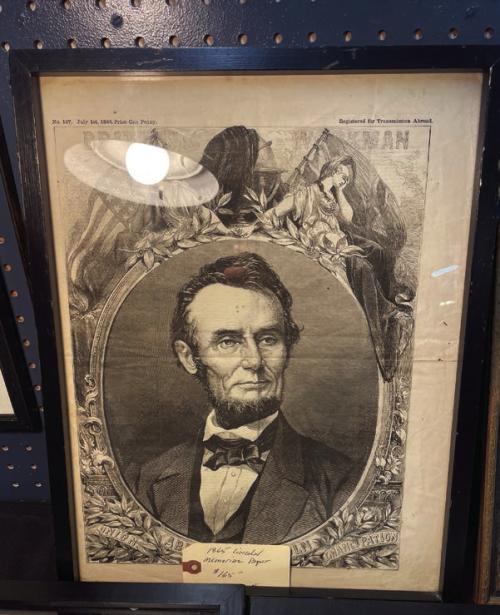 A portrait of Abraham Lincoln from an 1865 broadsheet newspaper.
