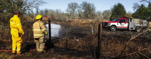 Last Friday, Ellinger and La Grange firefighters stayed busy fighting a series of grass fires that afternoon, including the one pictured (left) near the intersection of Kitchen Ln. and SH 71. Photo by Andy Behlen