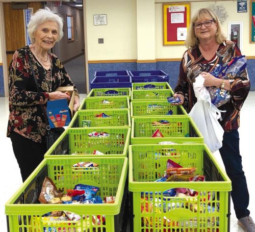 Fayette County Retired Teachers’ Association members fill the “goodie baskets” with snack items for active teachers/staff at all schools in Fayette County.