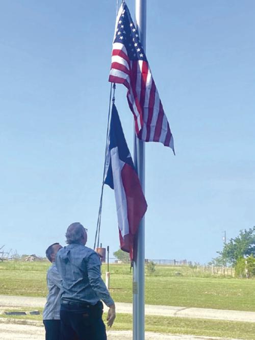 On Sunday, June 9, KJZT St. Elizabeth Society No. 20 donated new flags to St. Cyril &amp; Methodius Catholic Church in Cistern. Breakfast of sausage wraps, hot dogs, sweet rolls, and fruit was served after a brief flag raising ceremony. Patrick Vinklarek and Charles Vinklarek are shown raising the flags.