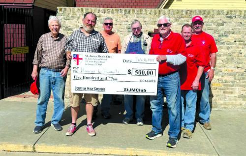 The St. James Men’s Club - Holy Smokers cooked for Fayette County Habitat for Humanity on Saturday, Feb. 15. Pictured from left are Dan Boyles, Kenny Couch (Executive Director of Habitat), Jimmy Klyng, Paul Crane, Joe Bailey, Jason Krupala, and Larry Kahanek.