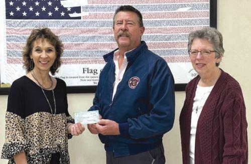 Hostyn KJT Society No. 3 presented a Christmas donation to the La Grange Volunteer Fire Department. Present for the picture from left was: KJT Treasurer Brenda Fietsam, La Grange Fire Chief Frank Menefee, and KJT Secretary Joyce Muras.