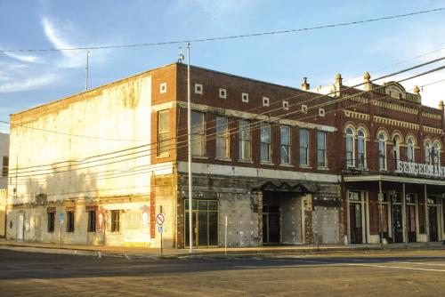 The former Schulenburg City Hall at the corner North Main St. and Upton Ave. has sat vacant since major structural issues were discovered earlier this year. The City initially tried renovating the building but then shifted gears in favor of building a new municipal complex to house both City Hall and the police station. Last Monday night, after facing some public pressure, the City Council voted to refocus efforts on restoring the downtown building. Photo by Andy Behlen