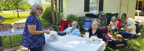The annual La Grange Garden Club caladium bulb sale provided the makings for great summer color in the yards of La Grange. Seated are club members Anna Boyd and Alison Hammerbacher who waited on customer Deborah Penny.