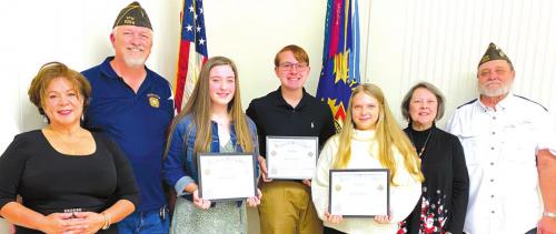 La Grange VFW and Auxiliary Voice of Democracy Winners from left: VFW and Auxiliary Contest Chairmen Mary and Richard Gray, first place winner Madelyn M. Kates, second place winner Westin T. Smith, and third place: Kaylee Ann Hensley, VFW Auxiliary Secretary Marilyn Kothmann, and VFW Commander Andy Kruppa.