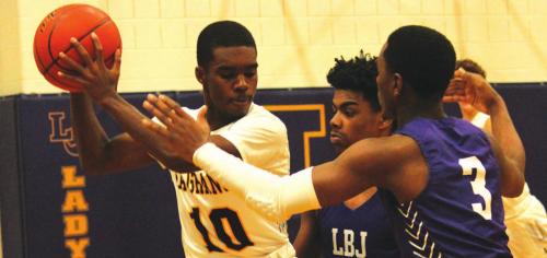 La Grange’s Jordan Scott looks for an opening amidst a double-team of Austin LBJ defenders in Tuesday’s game. Photos by Jeff Wick