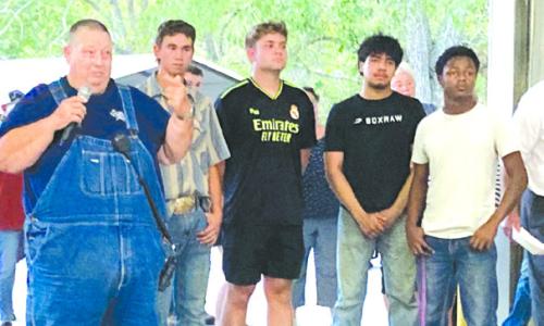 As part of Carmine Night Out, David Mohr, left, introduced the most recent members of the Junior Firefighter Program with the Carmine Volunteer Fire Department. They are left to right Lane Riley, Evan Blazek, Eric Noria, and Treveron Fischer.