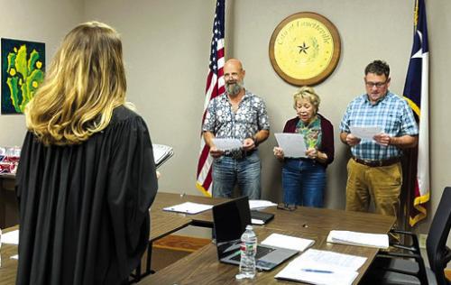 Fayetteville City Council members Todd Campbell, Debbie Lincke and Allen Jurecka sworn in by Justice of the Peace Jamie Moreau.
