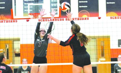 Fayetteville’s Brooklyn Jaeger goes up for a block against the spike of Schulenburg’s Tamara Otto in Tuesday’s match.
