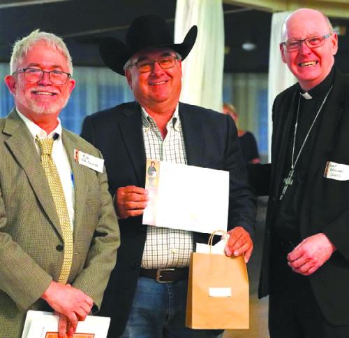 Pictured from left: Superintendent Robert Whitworth, Joe Orsak, Bishop Brendan Cahill.