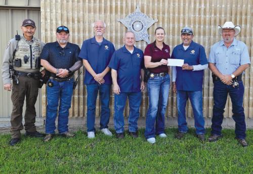 Knights of Columbus Chromcik Council No. 2574 donated $1,500 to the Fayette County Sheriff Benevolent Fund. Grand Knight Hector Cervantes presented the donation to Sgt. Angela Lala.