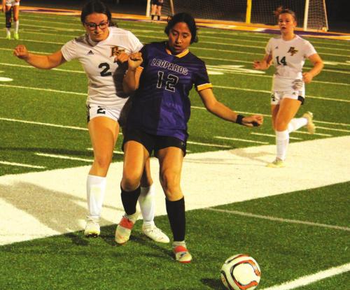 La Grange’s Camila Martinez, shown above blocking a Rockport-Fulton player, scored both goals for the Lady Leps Tuesday as they beat the Lady Pirates 2-1. Photos by Jeff Wick