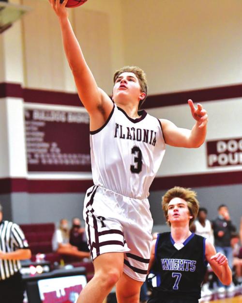 Aiden Kloesel puts it in for two for the Bulldogs on Tuesday night in Flatonia in the win over the Bellville Faith Academy Knights. Photo by Stephanie Steinhauser