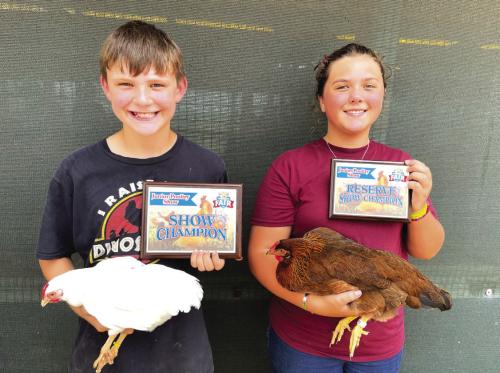 POULTRY SHOW • JUNIOR POULTRY from left, Keoni Brummond, grand; and Caleigh Klecka, reserve