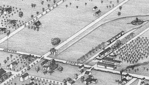 This detail from Koch’s 1880 Bird’s-Eye View of La Grange shows (6) the GH&amp;SA depot, (12) Schumacher’s ice house at the corner of Colorado and Jackson Streets, (10) Hunger’s Mill and Cotton Gin at the corner of Jackson and Crockett, and Bradshaw and White’s large warehouse is located just below the depot.
