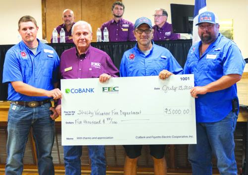 Shelby Volunteer Fire Department received $5,000 to assist with the purchase of a new pumper truck. Pictured from left to right are Shelby VFD Assistant Chief Blake Moehlmann; FEC Board President Joseph Kruppa; Shelby VFD firefighter Charles Atkins; and Shelby VFD firefighter Dennis Gaskins.