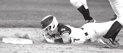 Flatonia’s Hannah Ellis dives in to second base before Schulenburg can lay down a tag. Photos by Stephanie Steinhauser