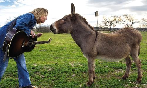Musician Terri Hendrix ‘horsing’ around. She said she might even premiere a song or three Saturday in La Grange from a brand new record she’s been working on.