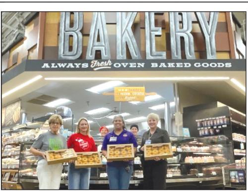 Shown left to right with donuts donated by La Grange HEB for distribution to Fayette County First Responders are: Sally Garrett and Krystal Seger, Fayette County Salvation Army Chapter Board Members; Claudia Reyes, HEB Bakery Manager and Liz Barta, HEB Top Store Leader.