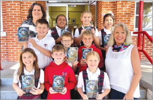 The Fayette County Republican Women group recently donated Dictionaries to each Third Grade student at St. Rose of Lima Catholic School in Schulenburg. Pictured is Patsy Parker of FCRW and Mrs. Sheila Klimitchek with her third grade class.