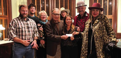 From left: accepting the check during the Round Top Chamber of Commerce Christmas Party RTFI Staff Chris Johnson, Ground’s Maintenance; James Dick, Founder and Artistic Director; Horticulturalist Julie Johnson and Crown Bar owner Beth Weishuhn; back row: Festival Hill Program Director Iverson Eliopoulos, staff member Pat Johnson, Vintage Clothing vendor Renee Rangel, and Crown Bar’s Andy Johnson.