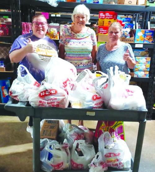 In recognition of their join hands day project, Hermann Sons Life Lodge of Rutersville donated 176 pounds of food items to the AMEN Food Pantry. Pictured from left are Megan Westfall (AMEN), Carol Jenkins of Hermann Sons, and Fran Dann (AMEN).