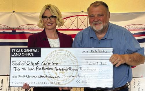 The City of Carmine recently received a grant from the Texas General Land Office for $2,548,300. Pictured are Commissioner Dawn Buckingham, MD, presenting the giant check to Wade Eilers, Mayor of Carmine. The funds will be used for a new water plant and water infrastructure upgrades.