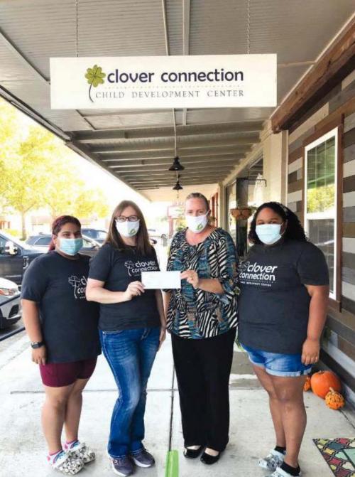 Pictured from left is: Ysenia Centeno/PreK 2 teacher, Lindsay Ahrens/owner, Susie Shank/Turtle Wing Foundation managing director, and Nikki Hernandez/PreK 3 teacher.