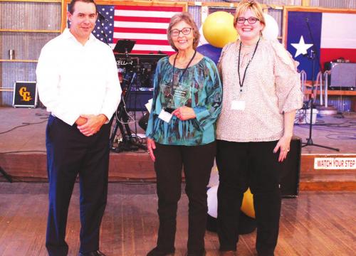 Linda Mattocks, center, was among the agents honored at a June 4 banquet hosted by Hermann Sons Life for its top producers. Presenting Linda with her award were President and CEO Eugene Zollinger and Vice President of Sales Robin Czarnek.