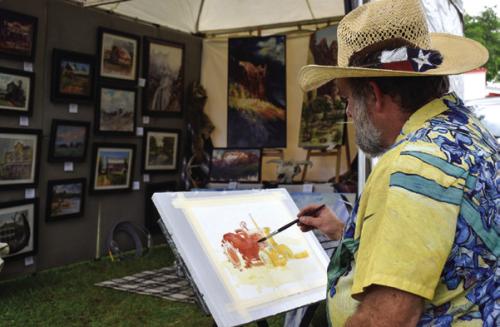 Artist Stephen Henry painting live at last year’s ArtWalk.