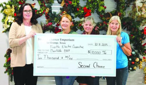 Tracy Denton, Director of Marketing, Communications, and Training at Fayette Electric Cooperative, gratefully receives a grant from Second Chance Emporium representatives — Marlene Schnell, assistant store director; Darlene Strahan, assistant store director; and Gayle Schielack, store director. The funds will help continue providing free books to children in Fayette County through Dolly Parton’s Imagination Library.