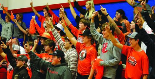 Schulenburg had a lot of students show up for Tuesday’s playoff victory over Kenedy at Nixon-Smiley. Here the students hold up “1” more point until a Lady Horns victory. Photo by Audrey Kristynik