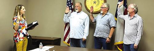 Justice of the Peace Jamie Moreau swore in Mayor Mike Stroup and City Councilmen Kelly Brooks and Cade Burks Monday.