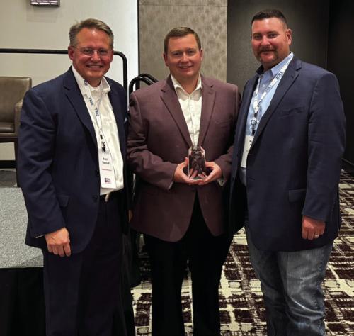 Fayette County EMS Director Josh Vandever (center) accepted the EMS Agency of the Year Award from the Texas EMS Alliance (TEMSA) at an educational conference last week. He is pictured with TEMSA President Butch Oberhoff (left) and TEMSA President-Elect Michael Furrh (right).
