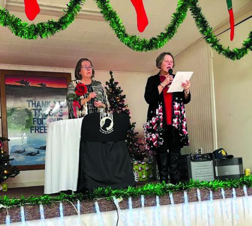 VFW Auxiliary President Marilyn Kothmann and Jr. Vice President Elizabeth Kallus presented the POW/MIA Table - Remembrance Ceremony.
