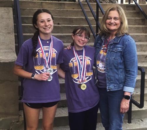 La Grange High School senior Riley Lowe, center, earned the gold medal placing 1st individually in Ready Writing, and LHS junior Eleanor Carey, left, earned the silver medal placing 2nd individually in Literary Criticism, on Saturday, April 26, at the Region 3-4A UIL Academic meet at Stephen F Austin State University in Nacogdoches. Riley and Eleanor will both compete at the State UIL Academic meet on Tuesday, May 20, at The University of Texas at Austin. Riley and Eleanor are both coached by Laurie Stork, 