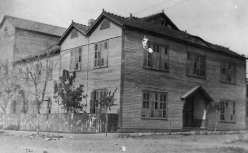 The St. Patrick’s Day program was given at the La Grange Opera House, located at the northwest corner of the intersection of Franklin and Colorado Streets where the city hall now stands. The front area along Franklin Street was a library and meeting room. The stage area was at the back of the building, with the audience seated in between on both the ground floor and on a large horseshoe-shaped gallery or balcony overhead.