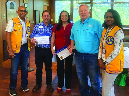 Mark Ulrich, Past District Governor inducted Damon and Roxanne Cotter to the La Grange Noon Lions Club. Their sponsors were Lions David and Deokie Ramjohn.
