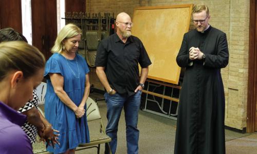 Bosque’s pastor, Fr. Chris Smith of Sacred Heart Catholic Church in La Grange, happened to be at City Hall on Tuesday for a proclamation signing with the local Catholic Daughters. He led a small group in prayer after City staff heard the news of Bosque’s death. Photo by Andy Behlen