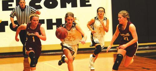 Round Top-Carmine’s Tess Eilers dribbles the ball as Fayetteville’s Emma Jurecka, left, and Rylie Dyer, right, converge defensively. Photo by Jeff Wick